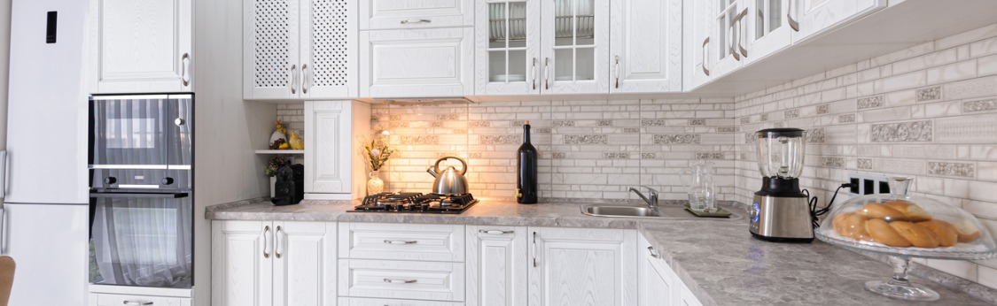 Luxury kitchen with white cabinets and counter